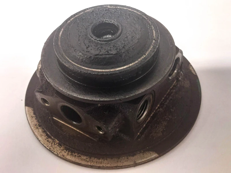 Oil-contaminated turbocharger CHRA caused by DPF-related back pressure