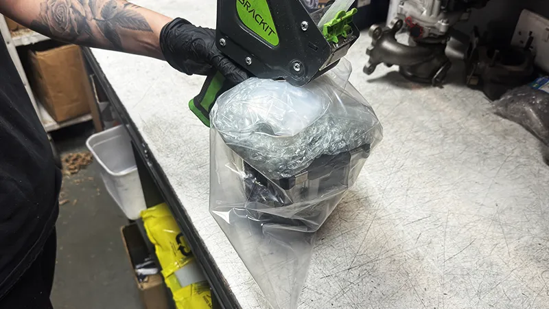 Remanufactured turbocharger sealed inside a plastic bag before packing