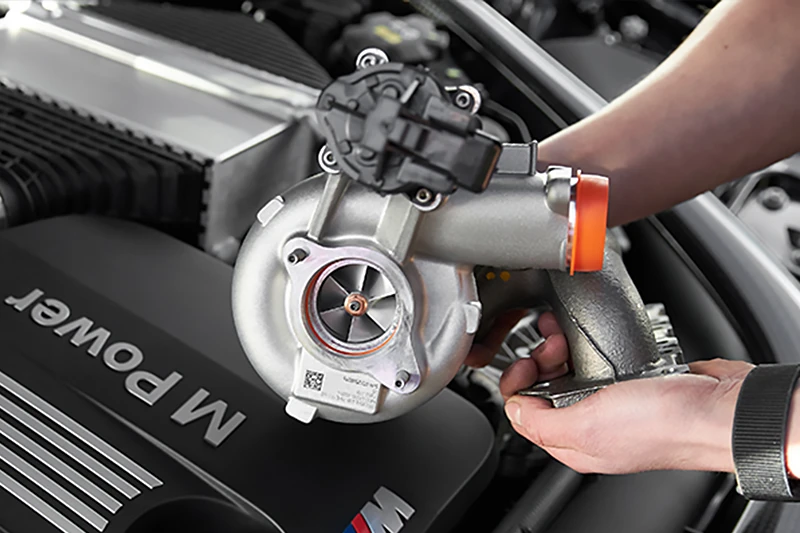 Replacement turbocharger being checked before fitting