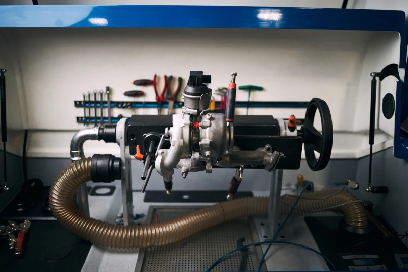 Turbocharger on balancing bench during turbo failure inspection