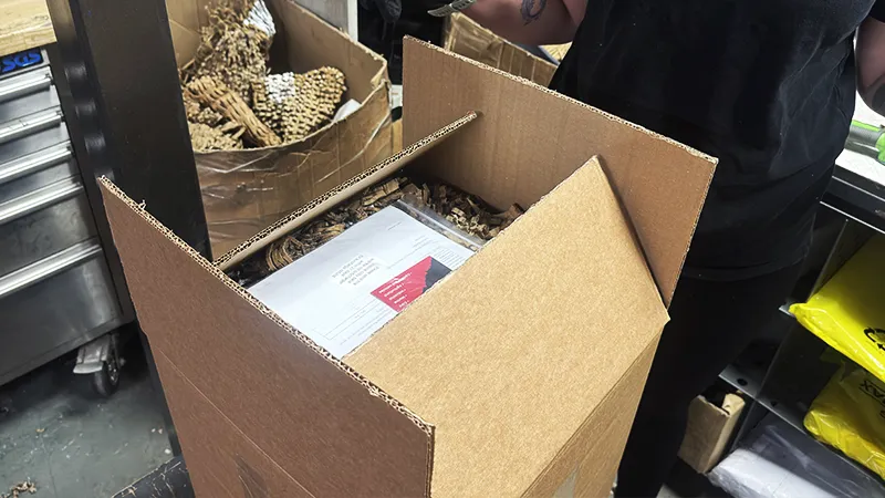 Order paperwork placed on top of the packed turbocharger inside the box