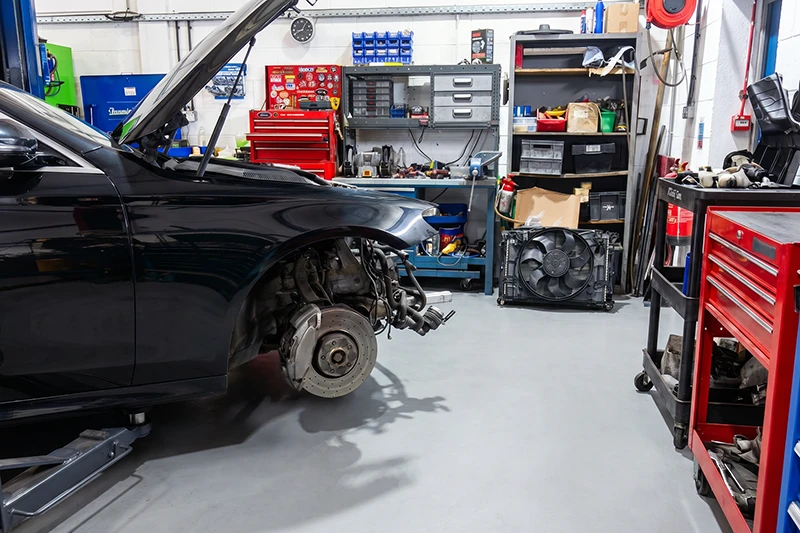 Vehicle on a workshop ramp at Turboworks with the front end removed for turbocharger replacement work