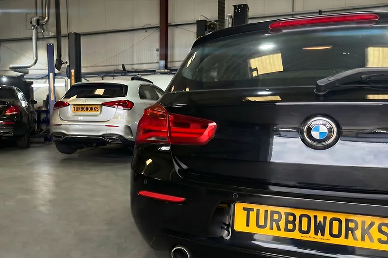 Turboworks workshop with vehicles inside for turbocharger repair, diagnostics and general mechanical work